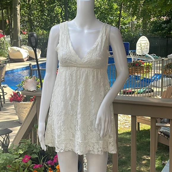 Dresses & Skirts - White lace, mini dress, more like a baby doll.